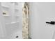 Shower with built-in shelves and a rod at 5241 Janfred Ct # 26, Las Vegas, NV 89103