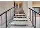 Stairway leading up to second-story condos shows sturdy construction and metal handrails at 5241 Janfred Ct # 26, Las Vegas, NV 89103