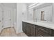 Modern bathroom with marble countertop, and shower-over-tub at 59 E Agate Ave # 406, Las Vegas, NV 89123