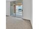 Bedroom with large sliding glass door to balcony at 59 E Agate Ave # 406, Las Vegas, NV 89123