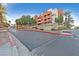 Contemporary condominium complex with manicured landscaping and a stylish entrance at 59 E Agate Ave # 406, Las Vegas, NV 89123