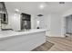 Bright kitchen with stainless steel appliances, light wood floors, and white countertops at 59 E Agate Ave # 406, Las Vegas, NV 89123