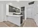 Modern kitchen featuring stainless steel appliances and breakfast bar at 59 E Agate Ave # 406, Las Vegas, NV 89123