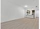 Open living space with wood flooring connecting to kitchen at 59 E Agate Ave # 406, Las Vegas, NV 89123