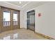 Well lit building lobby with marble tile flooring and elevator access at 59 E Agate Ave # 406, Las Vegas, NV 89123