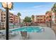 Community pool with lounge chairs and lush landscaping, perfect for relaxation at 59 E Agate Ave # 406, Las Vegas, NV 89123