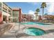 Community pool and spa area with lounge chairs and well-kept grounds at 59 E Agate Ave # 406, Las Vegas, NV 89123