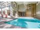 Indoor pool with floor to ceiling windows and a view of the community at 59 E Agate Ave # 406, Las Vegas, NV 89123