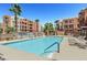 Resort-style pool area with ample seating and beautiful views of the surrounding buildings at 59 E Agate Ave # 406, Las Vegas, NV 89123
