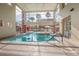 Indoor pool with large windows and doors that allow natural light to flood the space at 59 E Agate Ave # 406, Las Vegas, NV 89123
