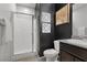 Modern bathroom featuring a glass enclosed shower, white tiling, and neutral vanity at 5918 Peridot Falls Ave, Las Vegas, NV 89130