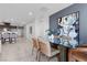 Elegant dining area with glass table and open layout to kitchen, perfect for Gathering gatherings at 5918 Peridot Falls Ave, Las Vegas, NV 89130