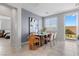 Bright dining area with modern glass table and patio access at 5918 Peridot Falls Ave, Las Vegas, NV 89130