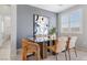 Chic dining room featuring contemporary decor and ample natural light from large window at 5918 Peridot Falls Ave, Las Vegas, NV 89130