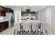 Modern kitchen with an island, granite countertops, stainless steel appliances, and ample storage at 5918 Peridot Falls Ave, Las Vegas, NV 89130