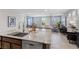 Open-concept kitchen boasts granite countertops, stainless steel appliances, and seamless flow to living area at 5918 Peridot Falls Ave, Las Vegas, NV 89130