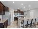 Bright kitchen with a large island, granite countertops, stainless steel appliances, and pendant lighting at 5918 Peridot Falls Ave, Las Vegas, NV 89130