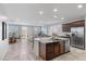 Spacious open-concept kitchen with an island, stainless steel appliances, and lots of natural light at 5918 Peridot Falls Ave, Las Vegas, NV 89130