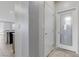Bright laundry room with storage, a laundry-themed glass door and easy access from kitchen at 5918 Peridot Falls Ave, Las Vegas, NV 89130