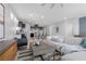 Open-concept living space featuring a comfortable sofa and seamless flow into the kitchen at 5918 Peridot Falls Ave, Las Vegas, NV 89130