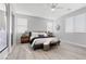 Inviting main bedroom featuring a cozy sitting area, soft lighting, and ample windows at 5918 Peridot Falls Ave, Las Vegas, NV 89130