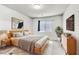 Comfortable bedroom with a plush bed, soft rug, and contemporary furnishings for relaxation at 5976 Rockway Glen Ave, Las Vegas, NV 89141