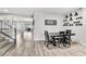 Dining room with a dining table and decorated shelves at 5976 Rockway Glen Ave, Las Vegas, NV 89141