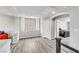 An upstairs hallway, with views into another room, has grey floors and neutral paint at 5976 Rockway Glen Ave, Las Vegas, NV 89141