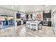 Spacious kitchen with a central island, stainless steel appliances, and access to the backyard patio at 5976 Rockway Glen Ave, Las Vegas, NV 89141