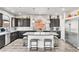 Stylish kitchen with a large island, stainless steel appliances, and ample cabinet space at 5976 Rockway Glen Ave, Las Vegas, NV 89141