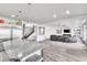 Open concept kitchen featuring island with pendant lighting connecting seamlessly to living room at 5976 Rockway Glen Ave, Las Vegas, NV 89141