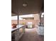 Stylish outdoor kitchen with a built-in grill, counter space, and brick paving at 5976 Rockway Glen Ave, Las Vegas, NV 89141