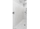 Sleek shower space with rainfall and handheld showerheads, featuring elegant marble-look walls at 5976 Rockway Glen Ave, Las Vegas, NV 89141