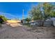 Large backyard with a shed, mature trees, and plenty of space for outdoor activities at 709 New Mexico St, Boulder City, NV 89005
