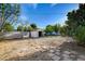 This large backyard offers a detached storage shed with sandy ground and paver accents at 709 New Mexico St, Boulder City, NV 89005