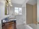 Bathroom featuring decorative vanity with carved wood, bath and shower combo and checkered tile at 709 New Mexico St, Boulder City, NV 89005
