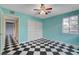 Bright bedroom with a ceiling fan and black and white flooring at 709 New Mexico St, Boulder City, NV 89005