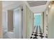 Hallway with checkered floors, leading to bathroom and bedroom at 709 New Mexico St, Boulder City, NV 89005