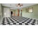Inviting living room featuring classic black-and-white checkered floors and bright light at 709 New Mexico St, Boulder City, NV 89005