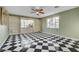 Inviting living area with built-in shelves, black-and-white tile, and a large window for natural light at 709 New Mexico St, Boulder City, NV 89005