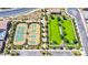 Aerial view of tennis courts and green space in a well landscaped community at 712 Webber Park St, Henderson, NV 89011