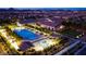 Community aerial view showcasing sparkling pools, landscaping, and buildings amidst a vibrant neighborhood setting at 712 Webber Park St, Henderson, NV 89011