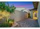 Private backyard with brick pavers, tasteful landscaping, and block wall at 712 Webber Park St, Henderson, NV 89011