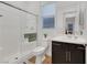 Modern bathroom features a walk-in shower, dark wood cabinets, and a white sink at 712 Webber Park St, Henderson, NV 89011