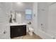 Bathroom featuring a shower over tub, single sink, and wood-look flooring at 712 Webber Park St, Henderson, NV 89011