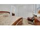 Bedroom with a queen-sized bed, sliding closet doors, and a comfy armchair at 712 Webber Park St, Henderson, NV 89011