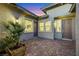 Private courtyard with brick pavers and lush greenery, perfect for outdoor relaxation and entertaining at 712 Webber Park St, Henderson, NV 89011