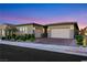 Charming single-story home with a two-car garage and well-maintained landscaping at 712 Webber Park St, Henderson, NV 89011