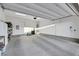 Spacious two-car garage with white walls and ample storage, ready for your vehicles and hobbies at 712 Webber Park St, Henderson, NV 89011