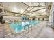 Bright indoor swimming pool with comfortable seating and plenty of natural light at 712 Webber Park St, Henderson, NV 89011